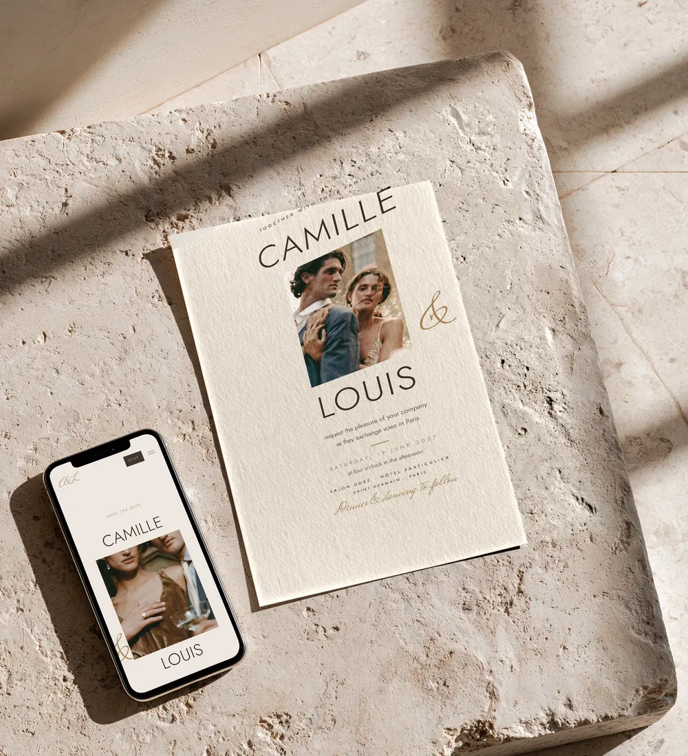 Lumière wedding invitation and wedding website on a phone, on a travertine block in afternoon sun
