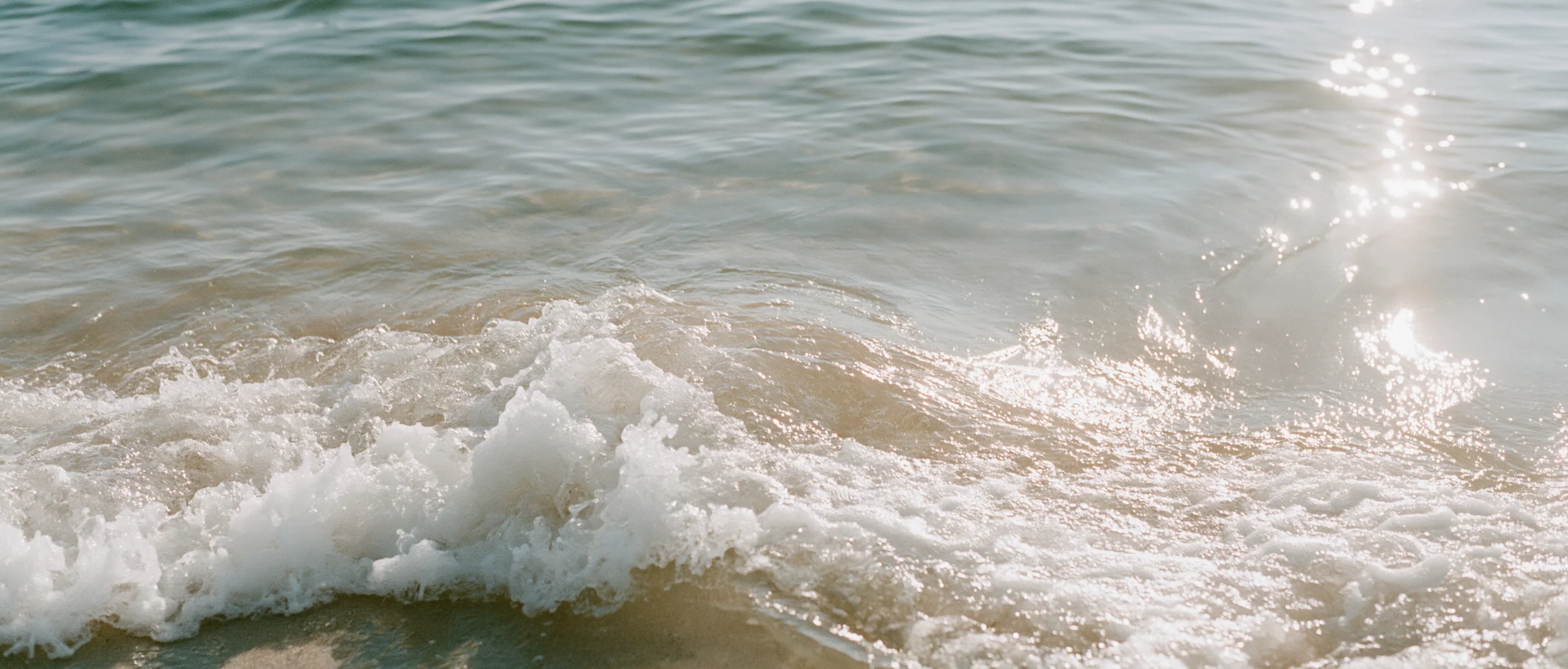 Sea foam on the sand in Uluwatu