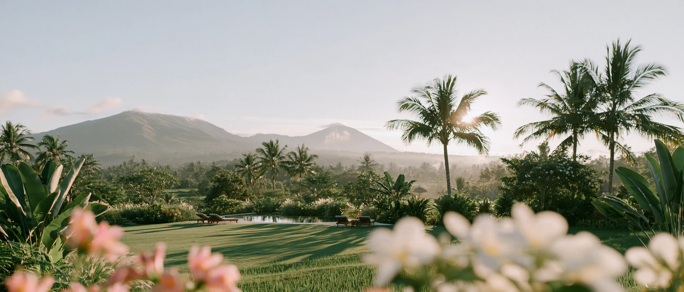Villa lawn with a volcano view and frangipani