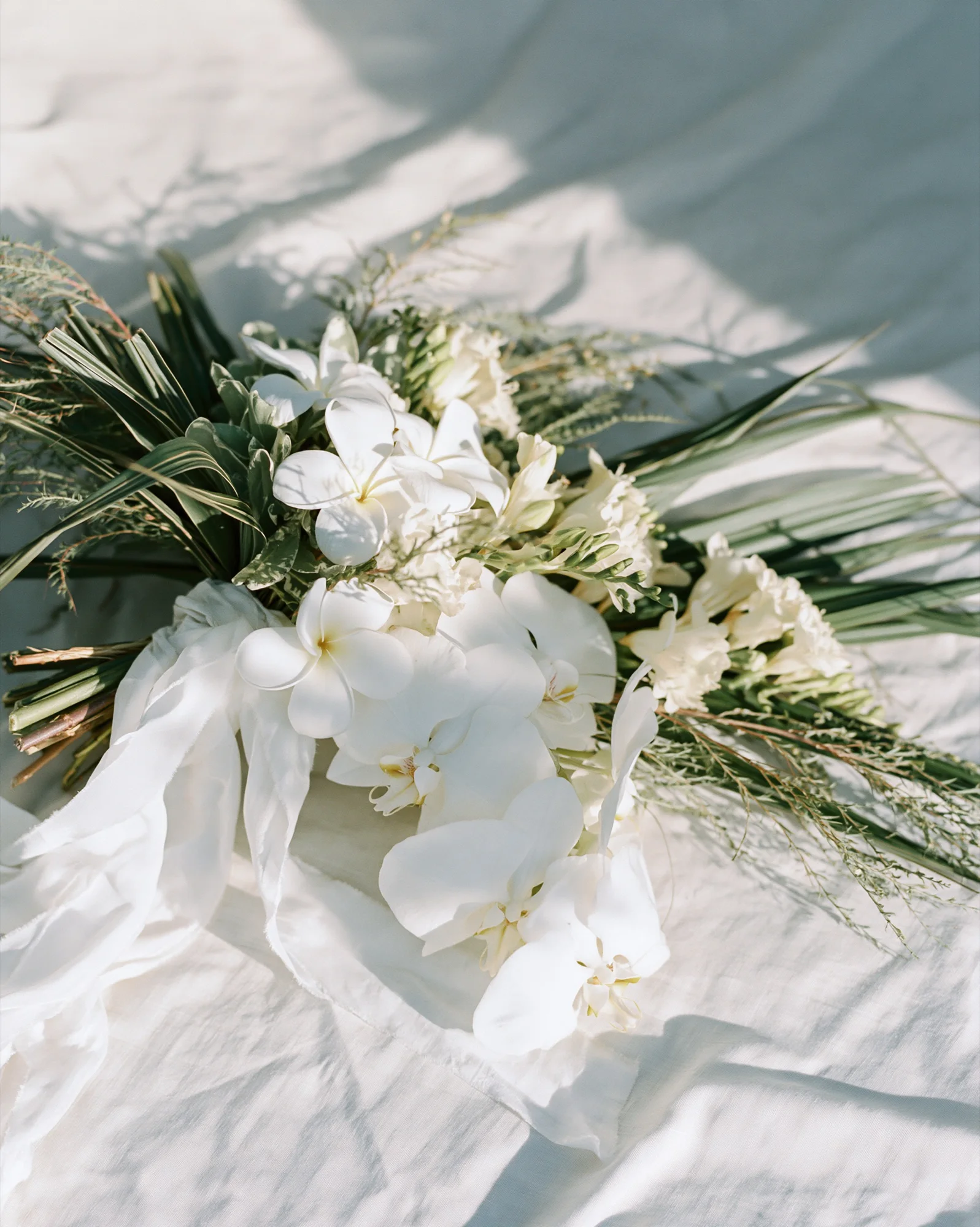 White orchid and frangipani bouquet