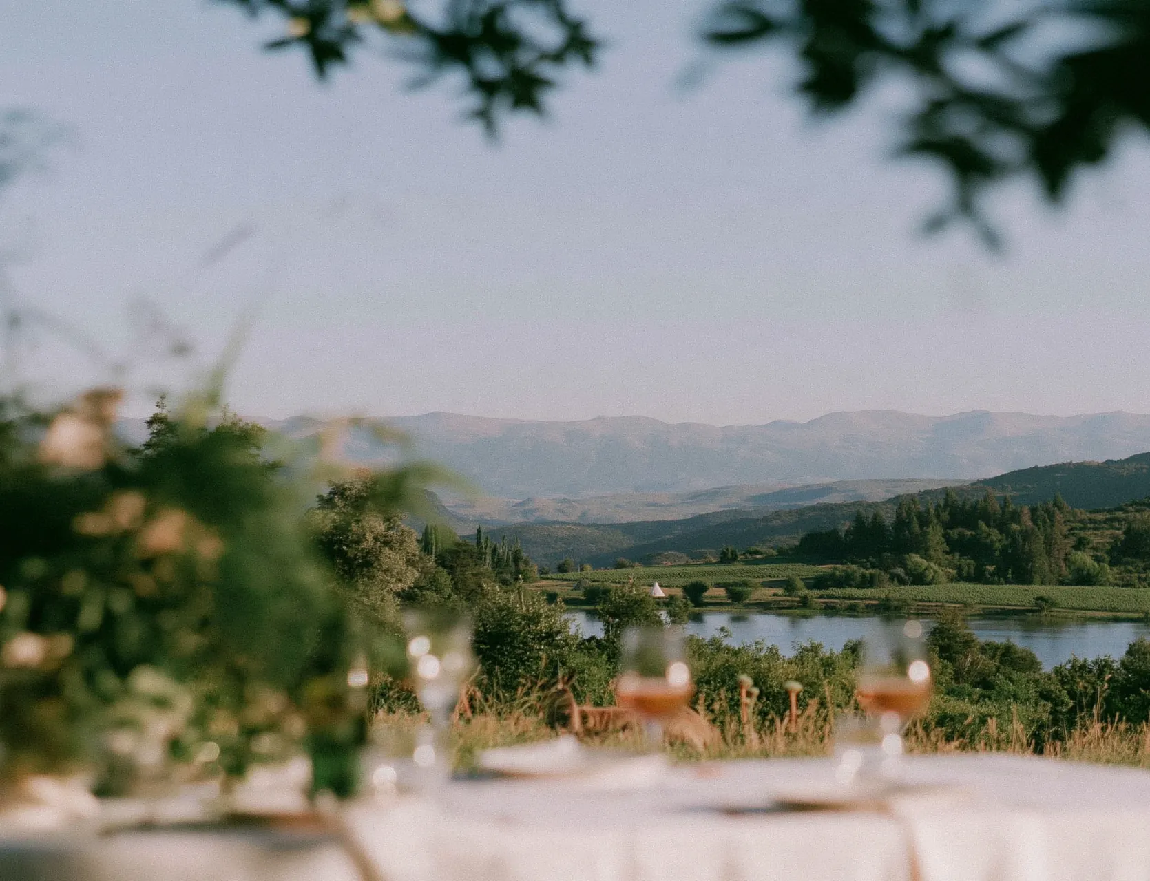 Wedding reception table set outdoors with mountain views