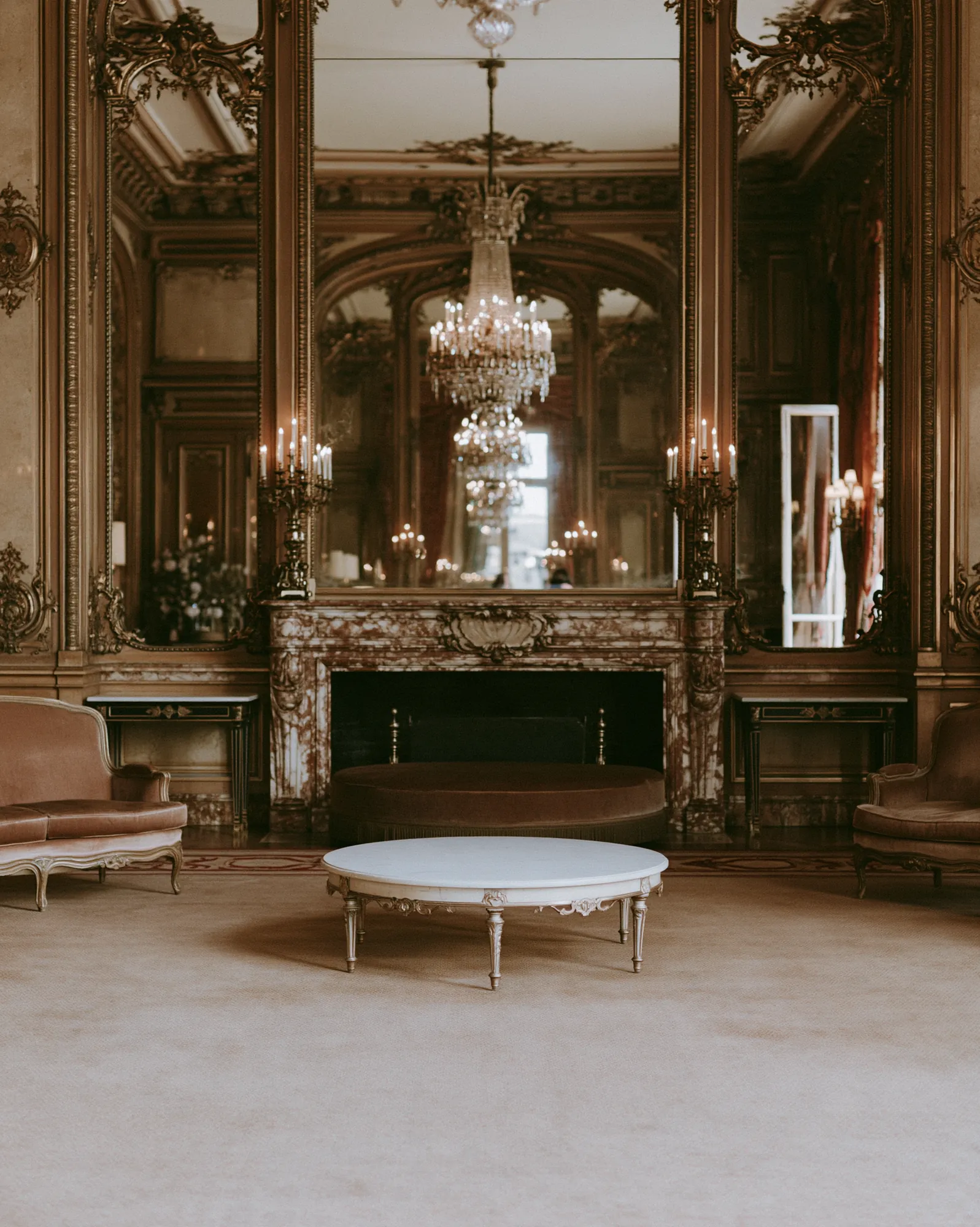 Gilded Parisian salon with mirrors and a crystal chandelier